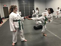 Students-practice-kicking-drills-at-Akula-Taekwondo-Wixom-MI-martial-arts-school